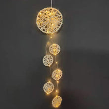 Artilady Love weaves dream catcher